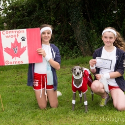 Two girls with a dog in fancy dress at the Somersham carnival Novelty Dog Show 2014.