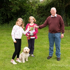 Two girls and their dog, awarded trophy at Somersham Carnival Dog Show by Neville Diss, compare.